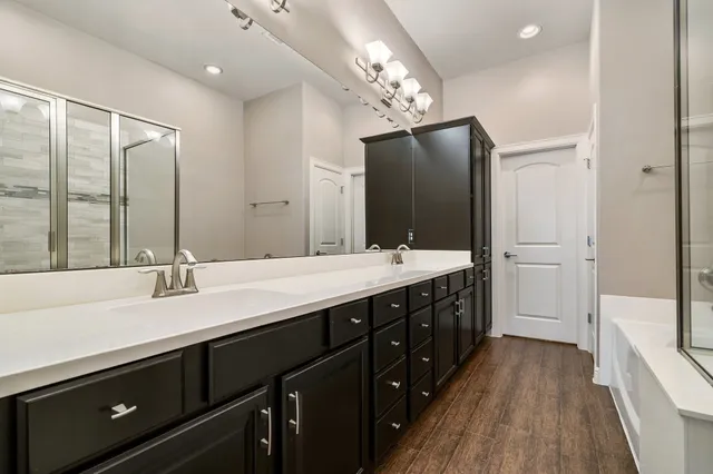 an empty room with fan and entrance