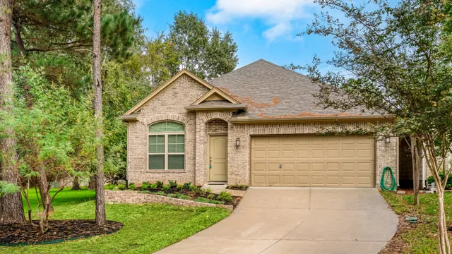 a bathroom with a sink a toilet a mirror a bathtub and shower