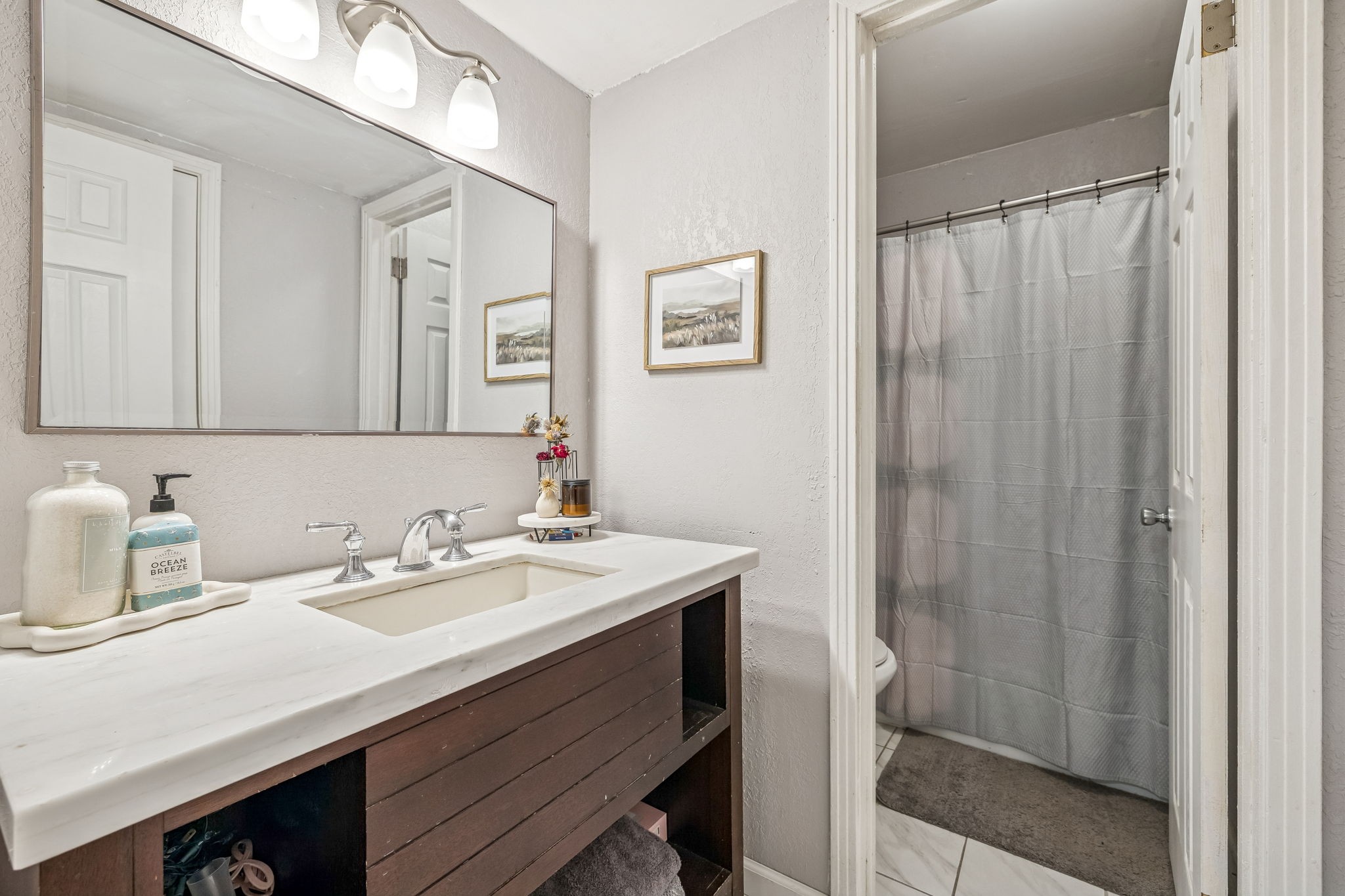 500 Paragon Mills Road, Unit E6 Nashville, TN 37211 - Photo 27 of 43 a bathroom with a sink a vanity and a mirror