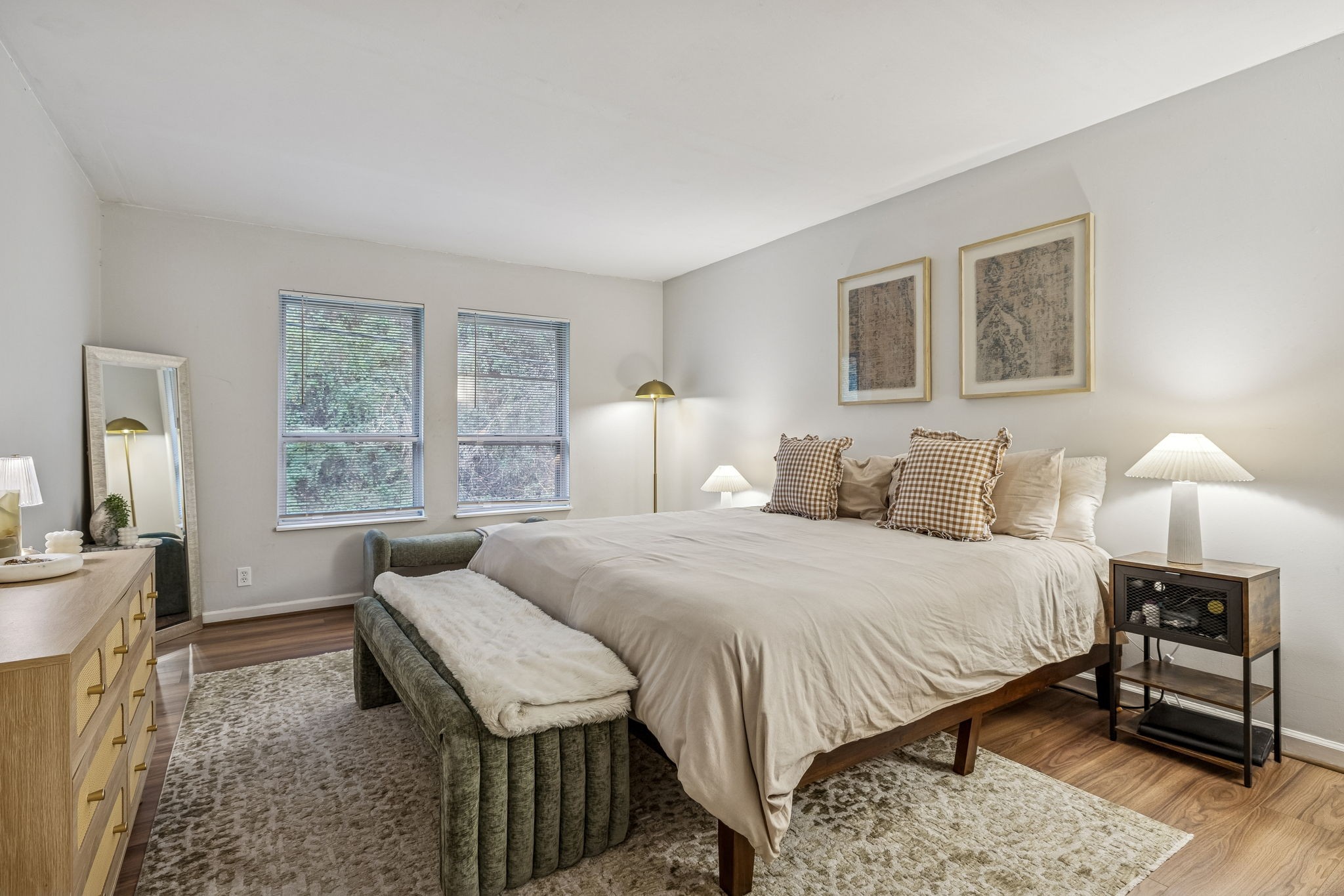 500 Paragon Mills Road, Unit E6 Nashville, TN 37211 - Photo 29 of 43 a bedroom with a bed and wooden floor