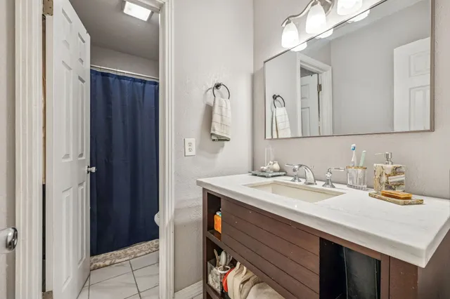 a bathroom with a sink and a mirror