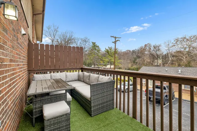 a view of a two chairs on the roof deck