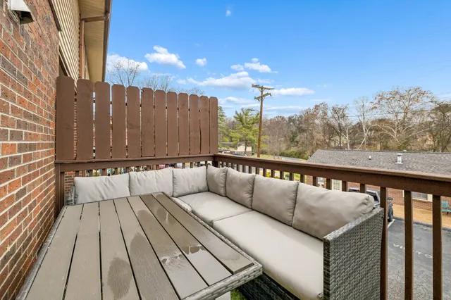 a view of balcony with furniture