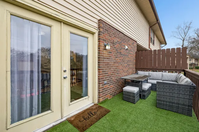 a view of a chairs in back yard of the house