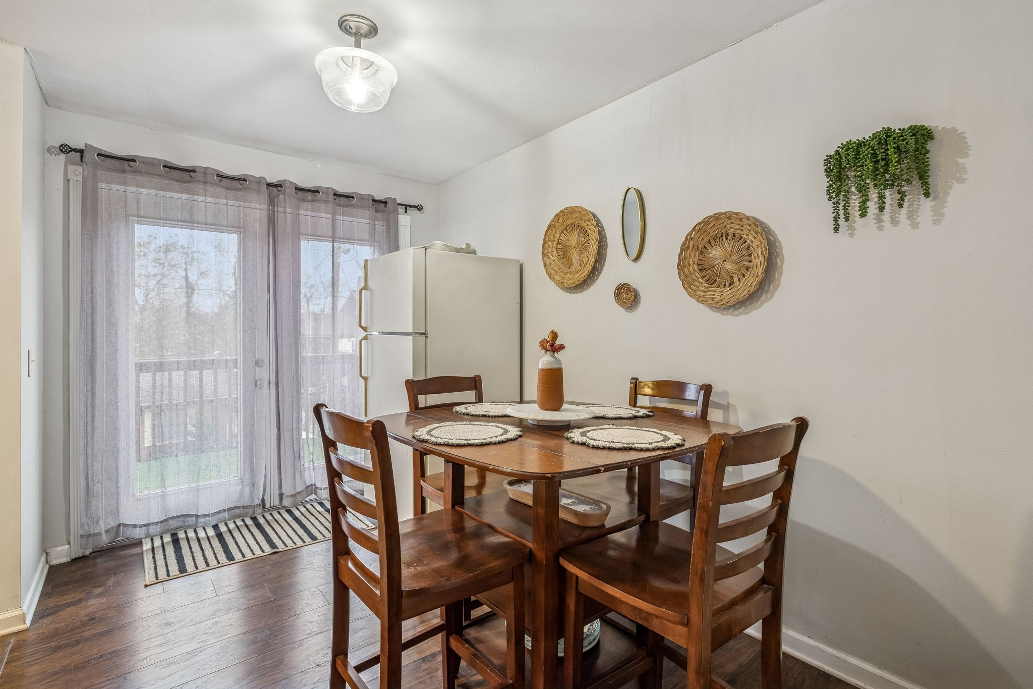 500 Paragon Mills Road, Unit E6 Nashville, TN 37211 - Photo 9 of 43 a dining room with a wooden table and chairs