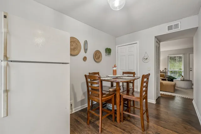 a view of a dining room with furniture and wooden floor