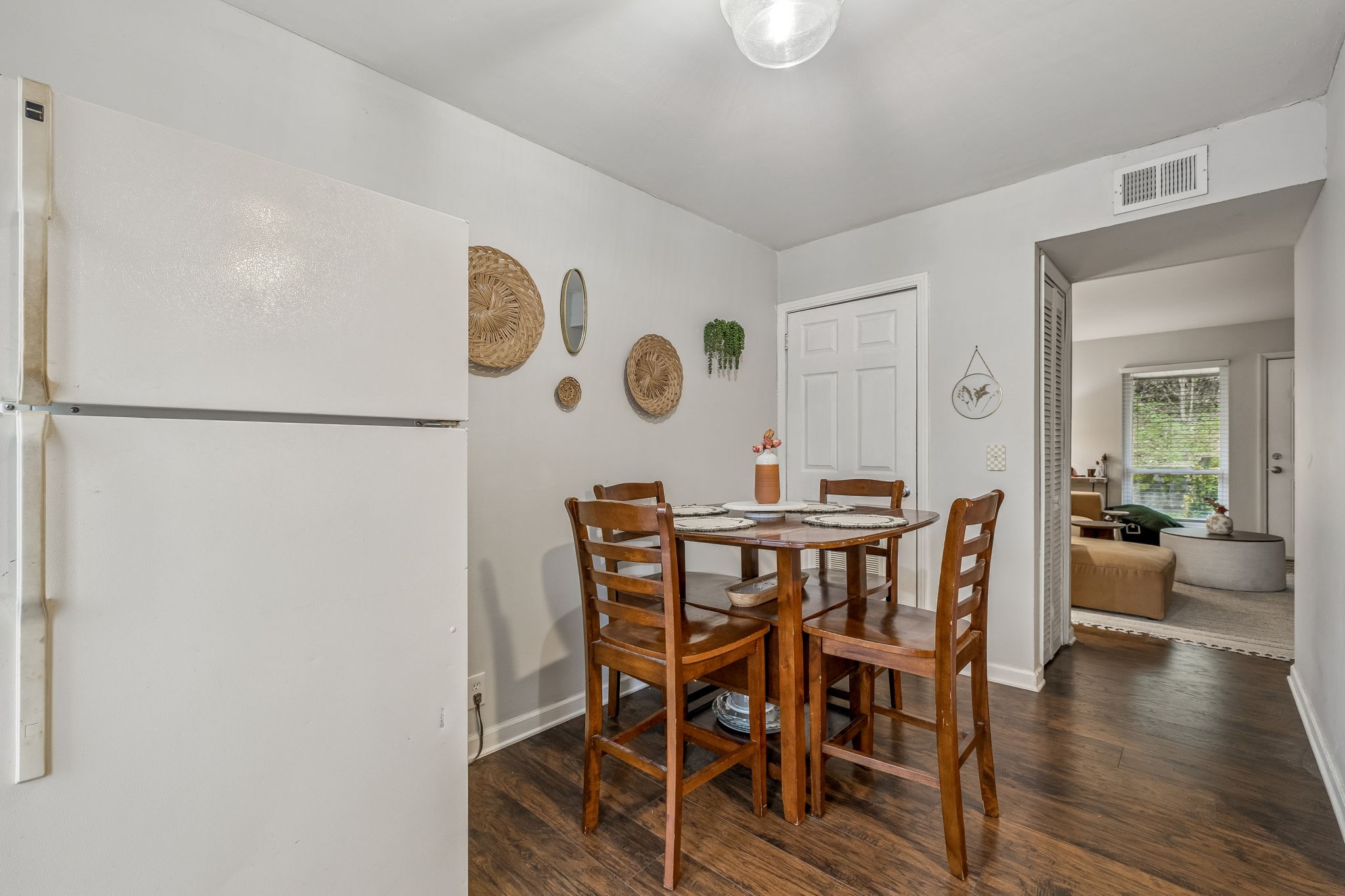 500 Paragon Mills Road, Unit E6 Nashville, TN 37211 - Photo 10 of 43 a view of a dining room with furniture and wooden floor