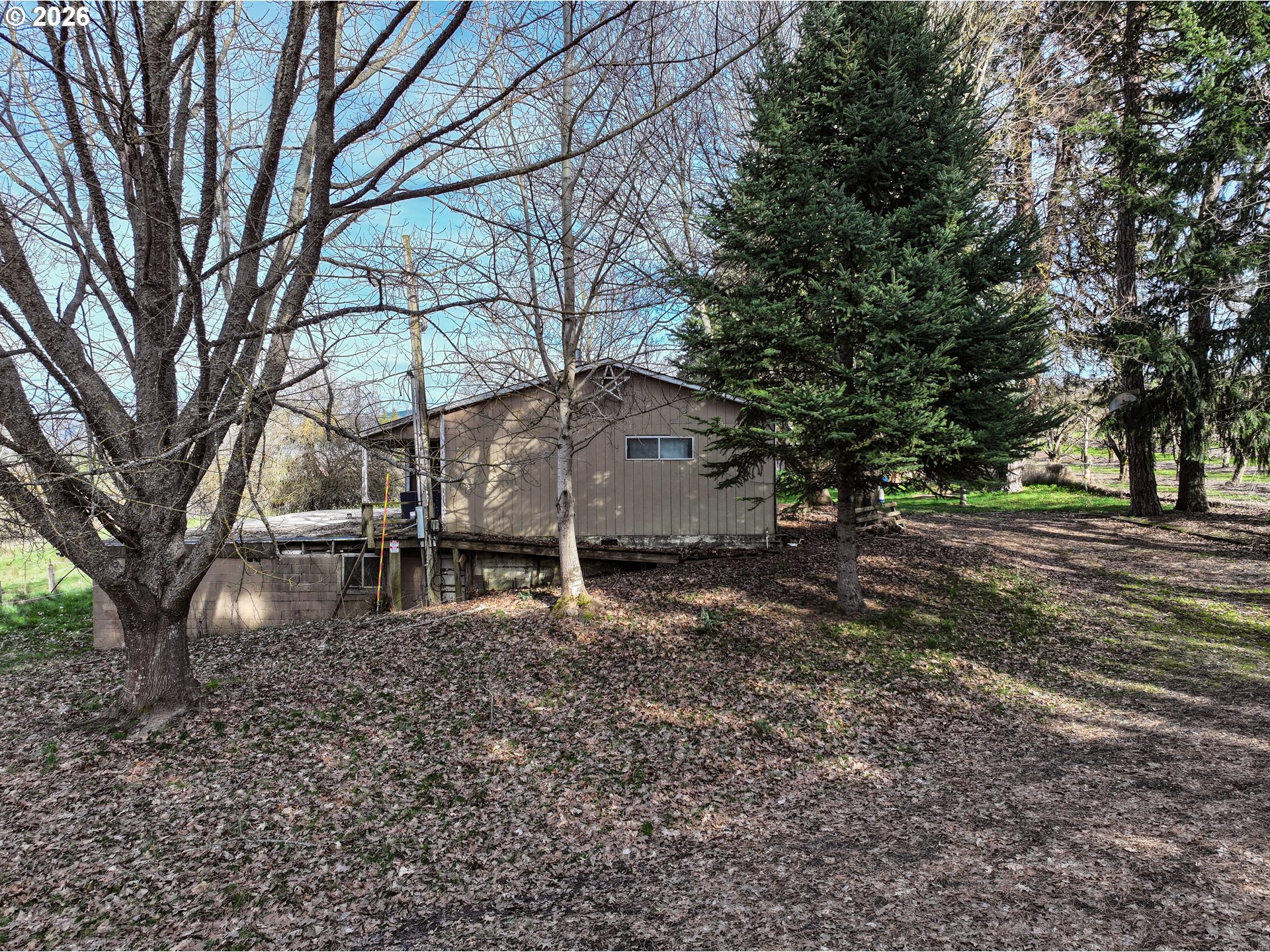 2739 Wyeast Road Hood River, OR 97031 - Photo 19 of 28 a view of a backyard with large trees