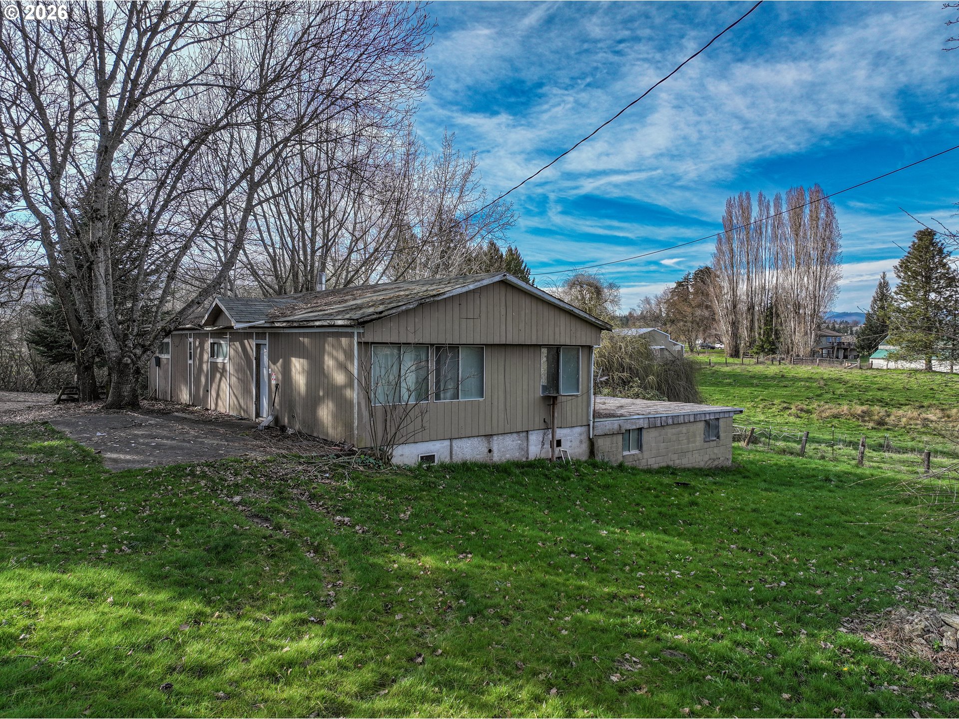 2739 Wyeast Road Hood River, OR 97031 - Photo 22 of 28 a view of a house with a yard and sitting area