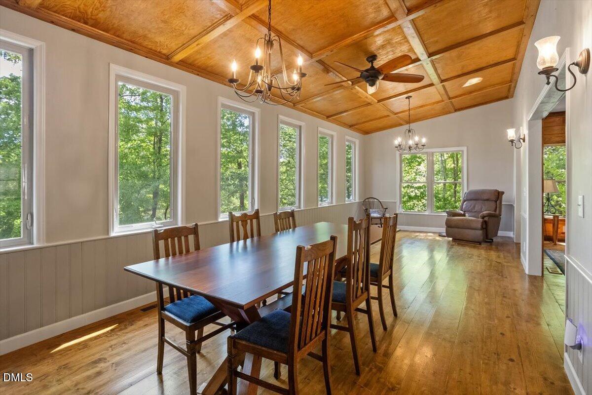 160 Stillwater Lane Roxboro, NC 27574 - Photo 12 of 57 a view of a dining room with furniture window and wooden floor