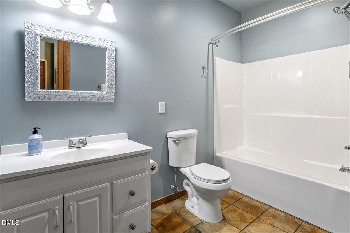 160 Stillwater Lane Roxboro, NC 27574 - Photo 18 of 57 a bathroom with a sink toilet and shower