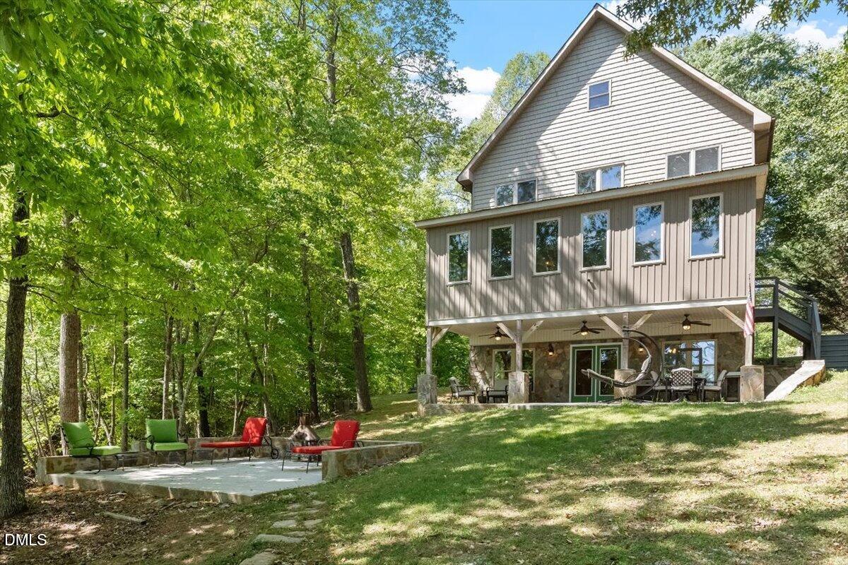 160 Stillwater Lane Roxboro, NC 27574 - Photo 2 of 57 a view of a house with a backyard porch and sitting area