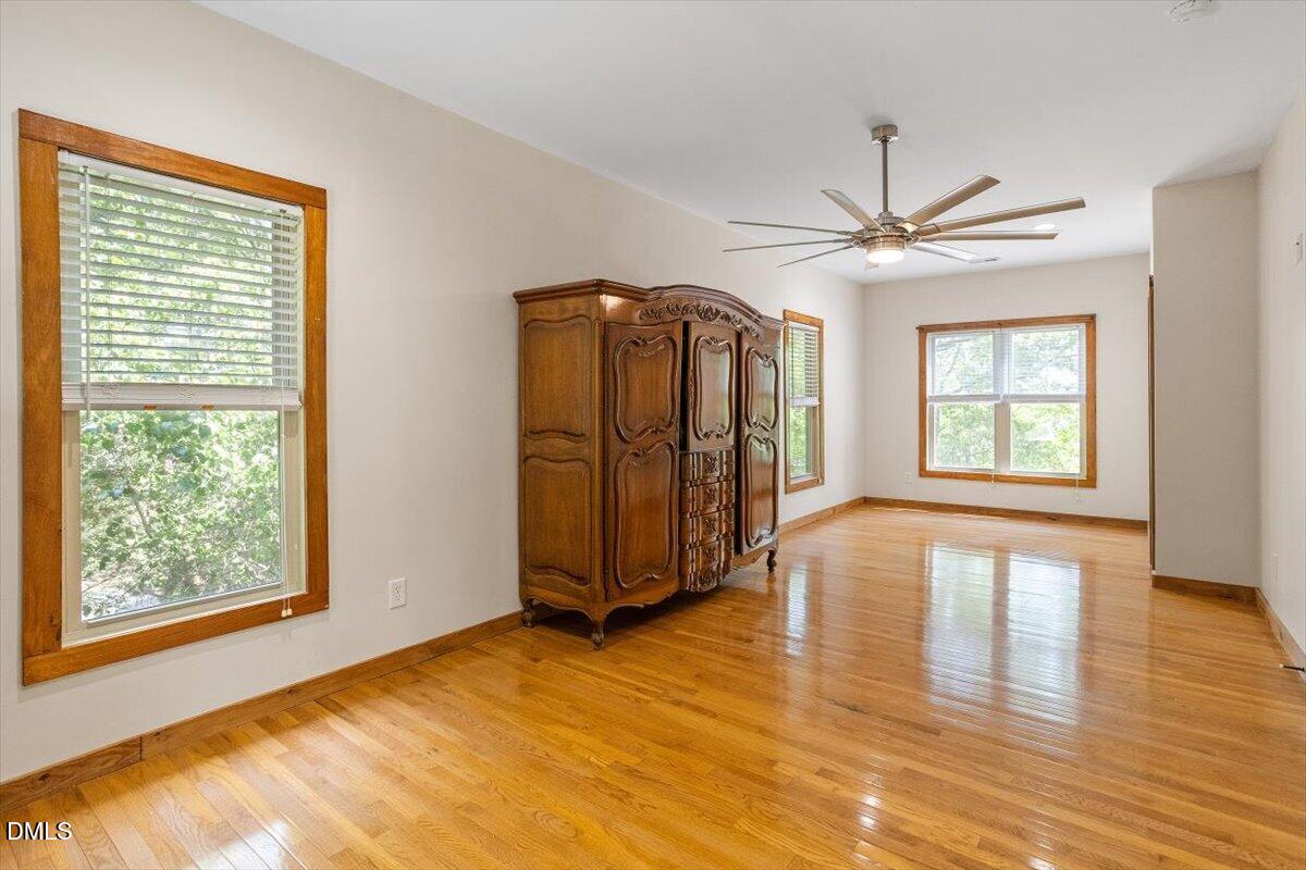 160 Stillwater Lane Roxboro, NC 27574 - Photo 22 of 57 a view of an empty room with window and wooden floor