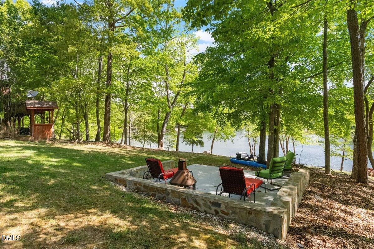 160 Stillwater Lane Roxboro, NC 27574 - Photo 3 of 57 a view of a backyard with large tree