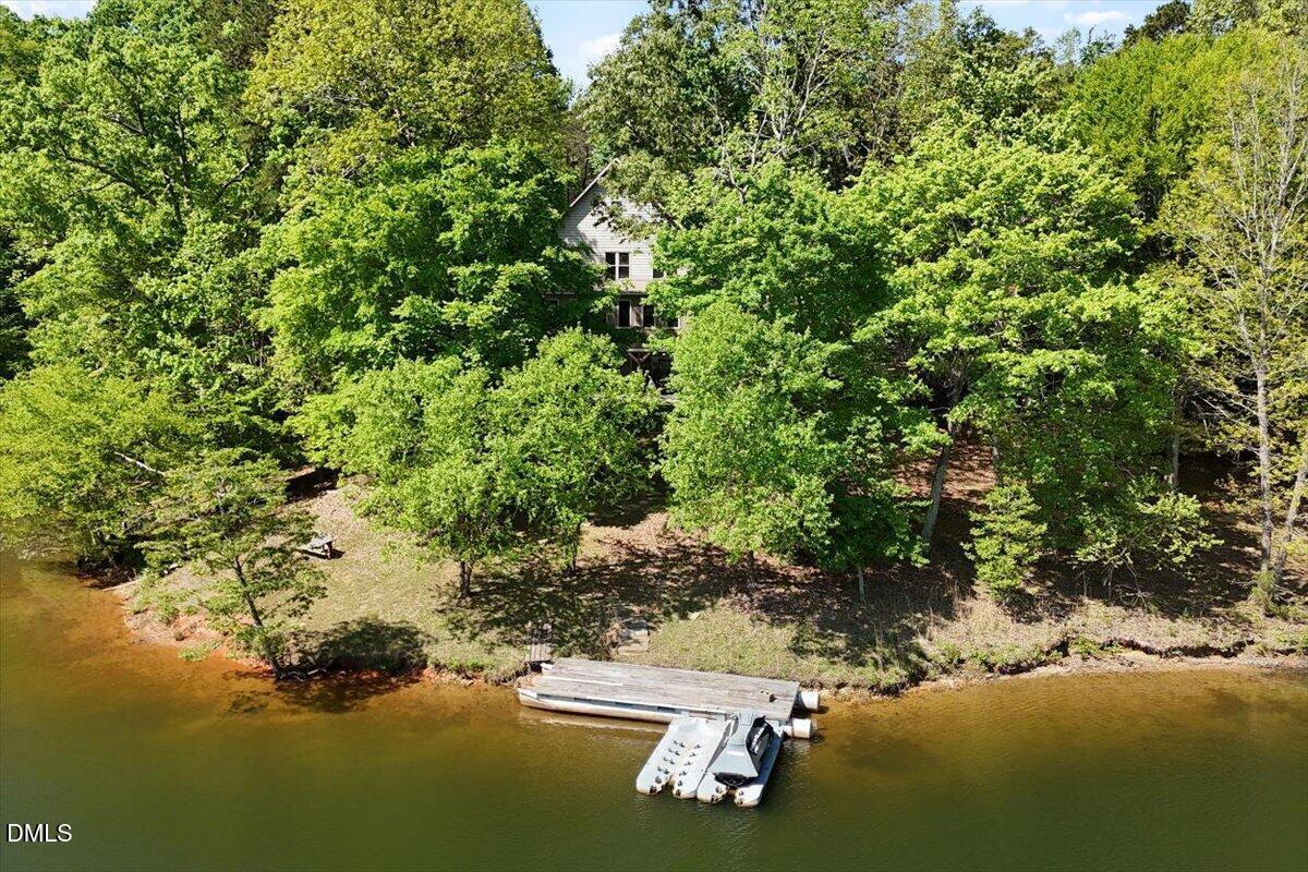 160 Stillwater Lane Roxboro, NC 27574 - Photo 4 of 57 a view of a lake from a yard