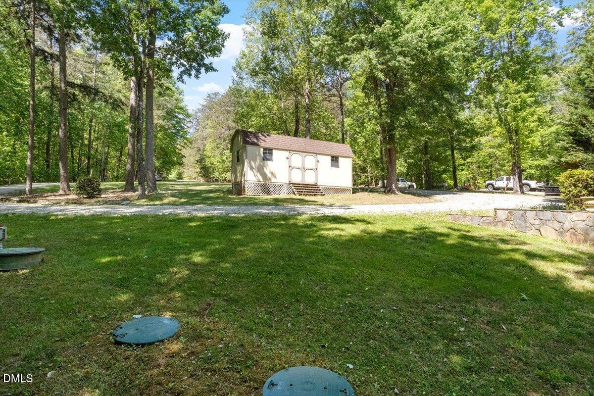 160 Stillwater Lane Roxboro, NC 27574 - Photo 45 of 57 a swimming pool with some trees in the background