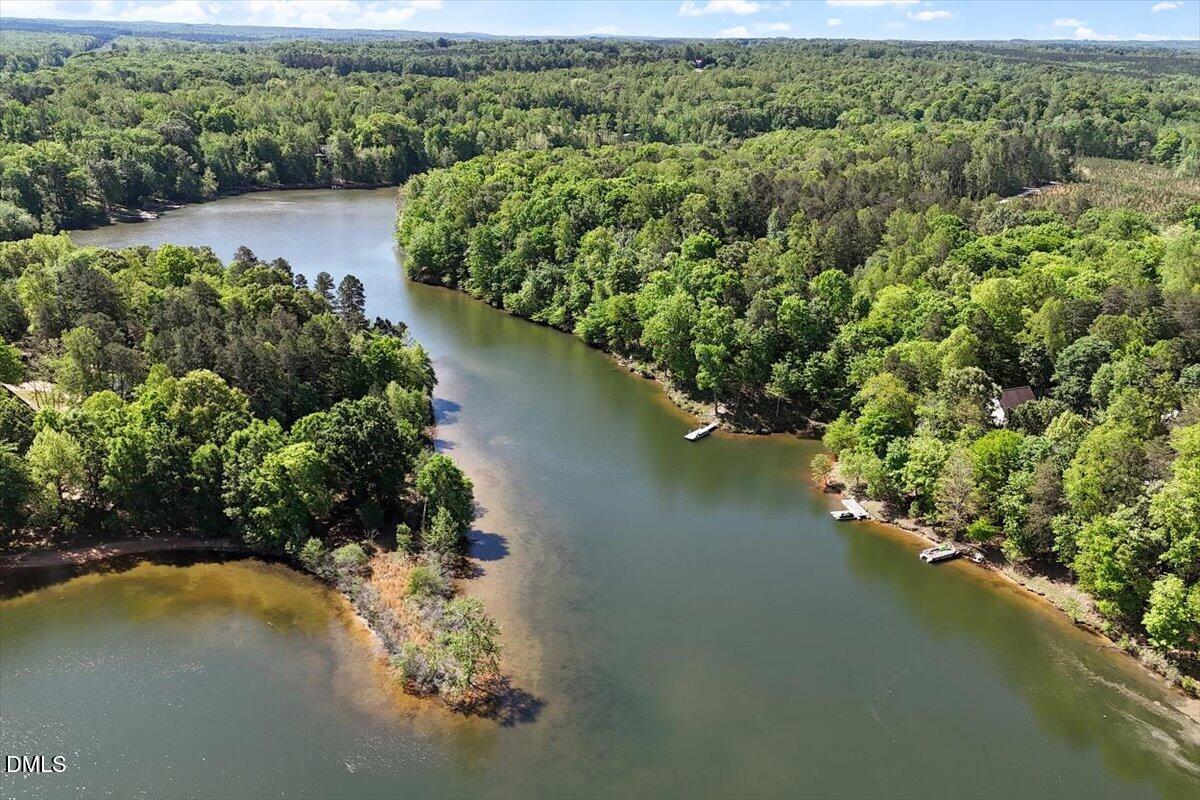 160 Stillwater Lane Roxboro, NC 27574 - Photo 48 of 57 a view of a lake with a yard and mountain view