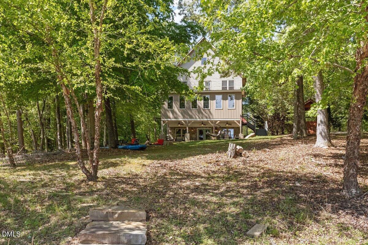 160 Stillwater Lane Roxboro, NC 27574 - Photo 50 of 57 a house with trees in front of it