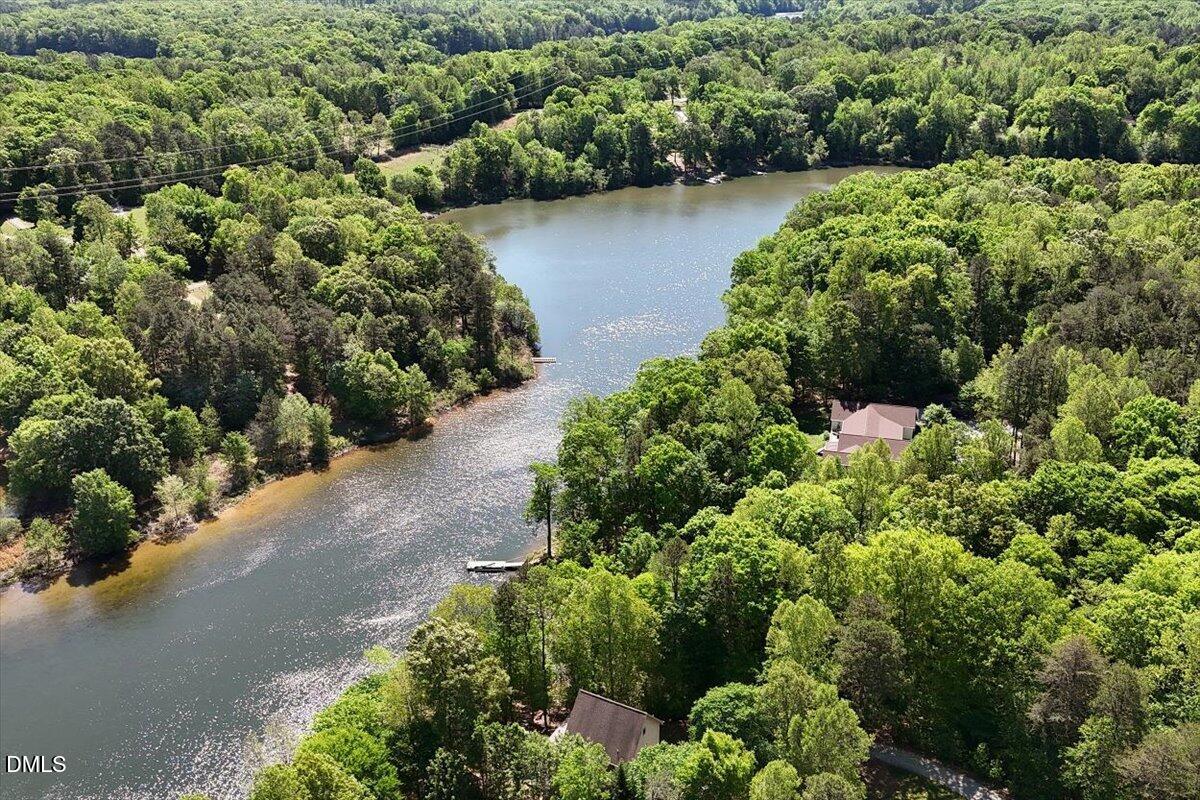 160 Stillwater Lane Roxboro, NC 27574 - Photo 51 of 57 an aerial view of a houses with a yard and lake