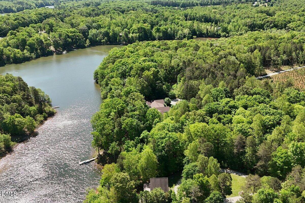 160 Stillwater Lane Roxboro, NC 27574 - Photo 52 of 57 an aerial view of a houses with a yard and lake