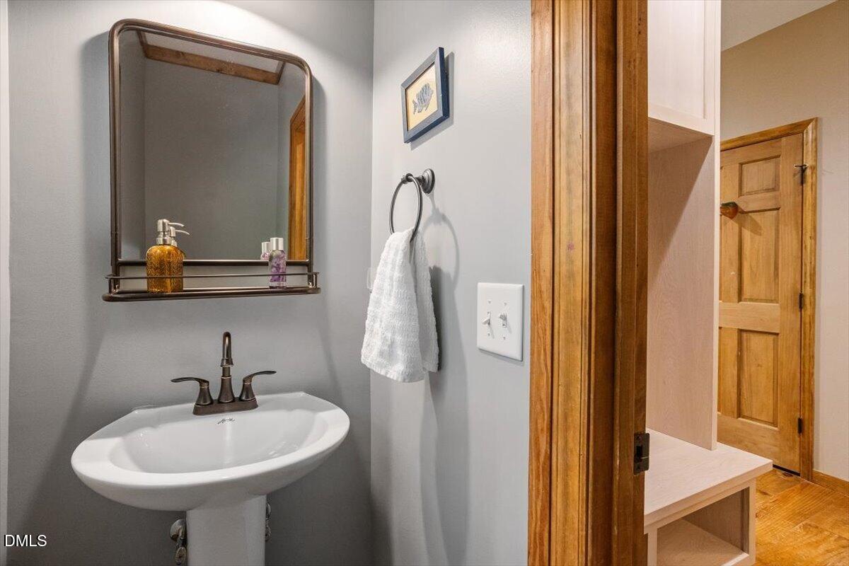 160 Stillwater Lane Roxboro, NC 27574 - Photo 10 of 57 a bathroom with a sink a mirror and shower