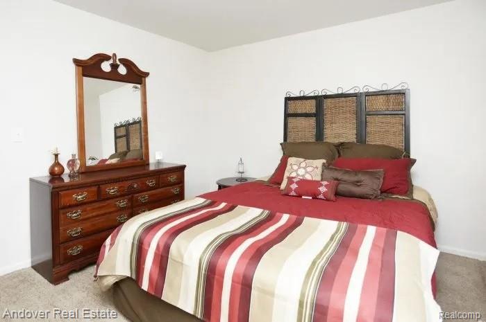 312 South Drake Road Kalamazoo, MI 49009 - Photo 15 of 21 Plush carpet flooring, neutral wall color, and a textured headboard