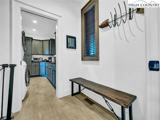 a view of a hallway with furniture