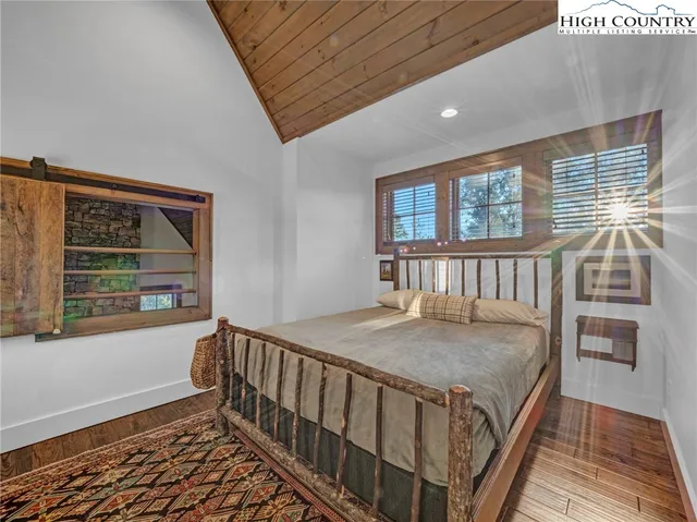 a bedroom with furniture and a window