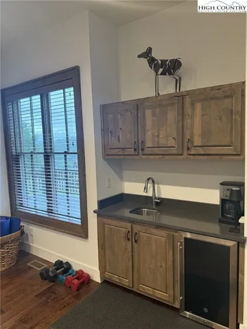 a kitchen with sink and cabinets