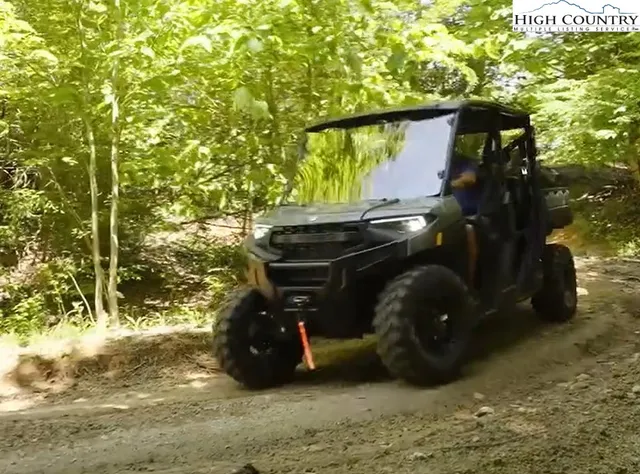 a view of gym equipment and floor to ceiling window