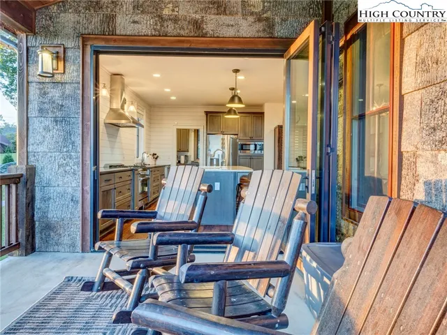 a view of a hallway with furniture and front door