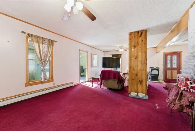 a bed room with furniture and a window