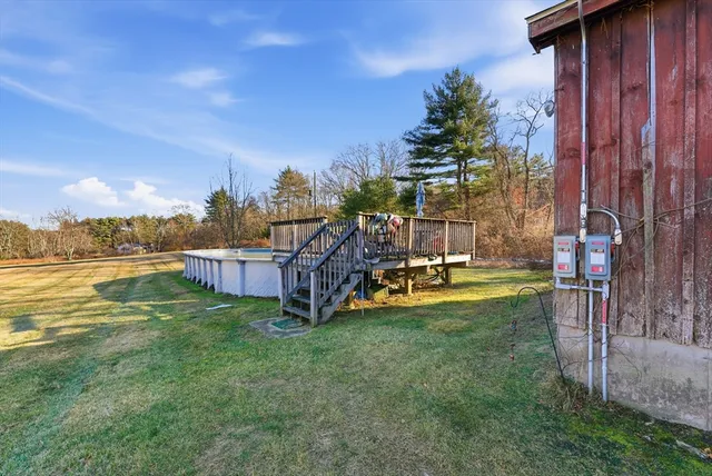 a view of a house with swimming pool yard and sitting area