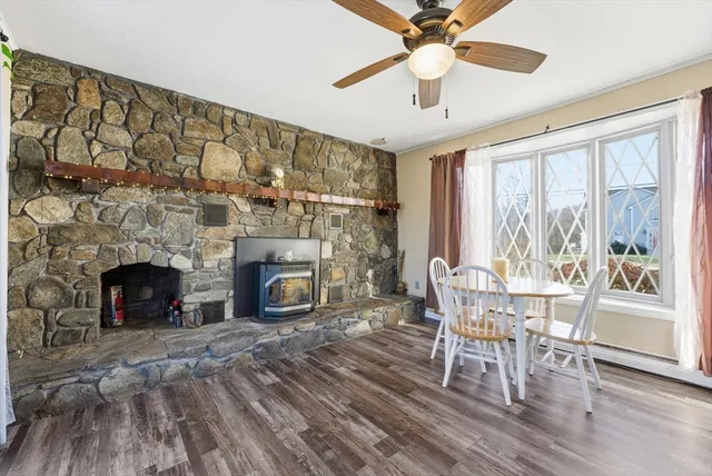 a view of a livingroom with furniture and a fireplace