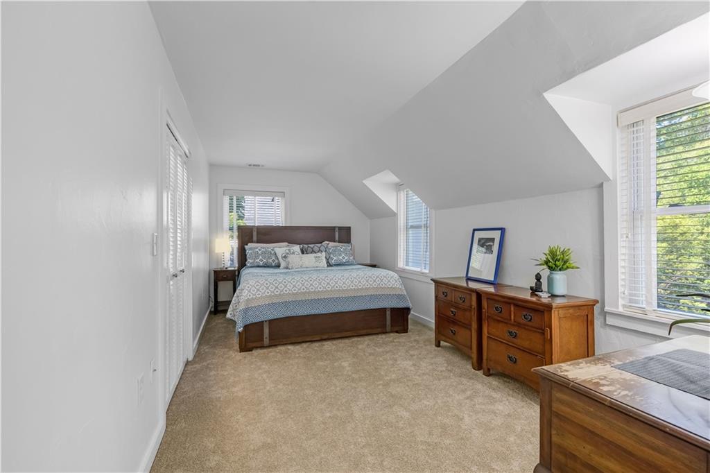 449 Nelson Ferry Road Decatur, GA 30030 - Photo 18 of 29 a bedroom with a bed and windows