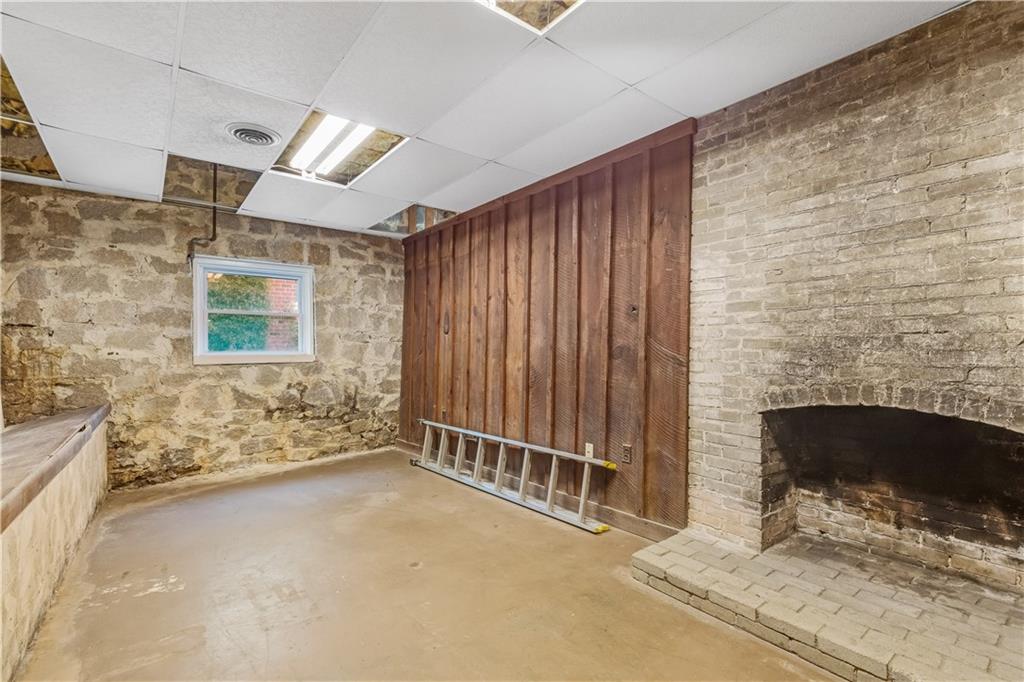 449 Nelson Ferry Road Decatur, GA 30030 - Photo 20 of 29 a view of an empty room with a fireplace