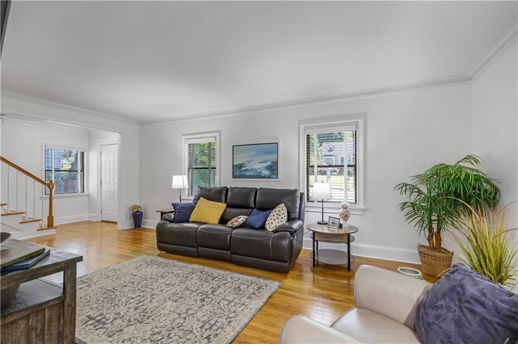 449 Nelson Ferry Road Decatur, GA 30030 - Photo 4 of 29 a living room with furniture potted plant and a window