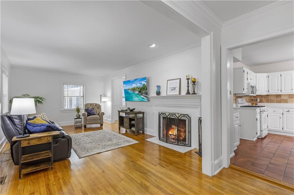 449 Nelson Ferry Road Decatur, GA 30030 - Photo 6 of 29 a bedroom with furniture and a fireplace