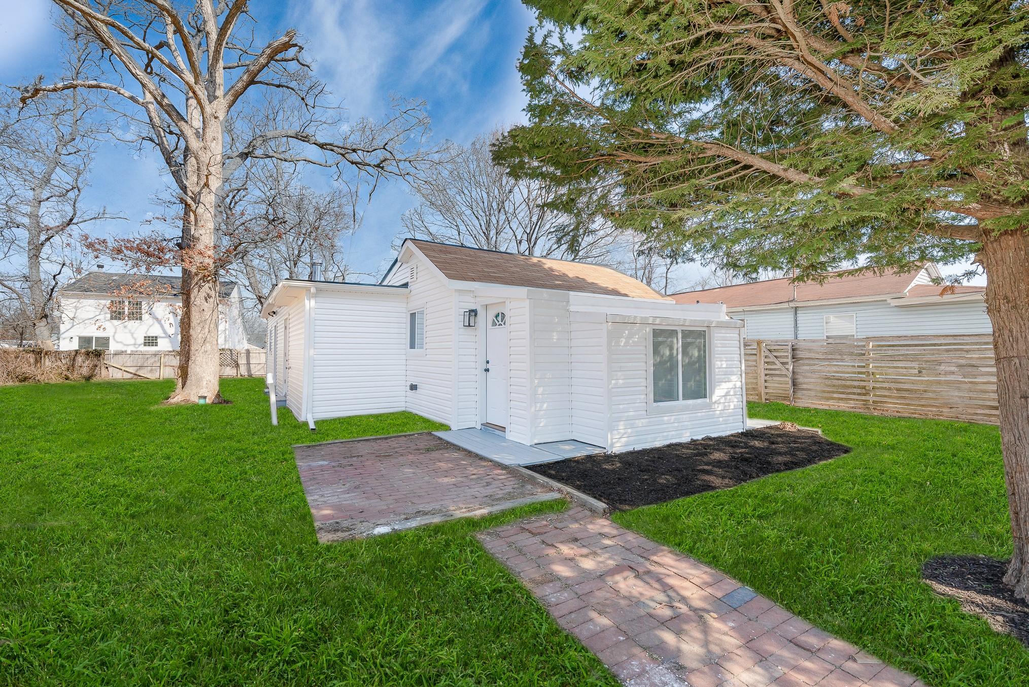 277 Forest Road West Mastic Beach, NY 11951 - Photo 1 of 1 View of outbuilding with a fenced backyard and an outdoor structure