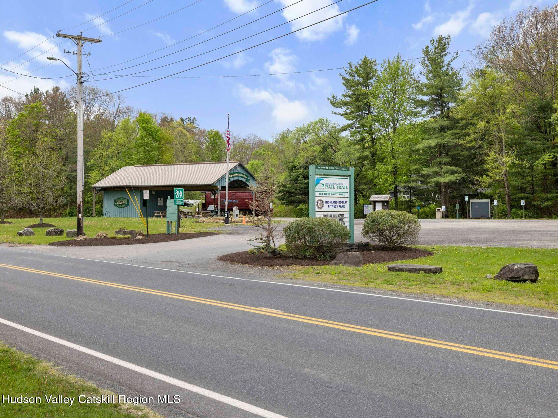104 New Paltz Road Highland, NY 12528 - Photo 43 of 43 a view of a swimming pool with a lawn chairs under an umbrella