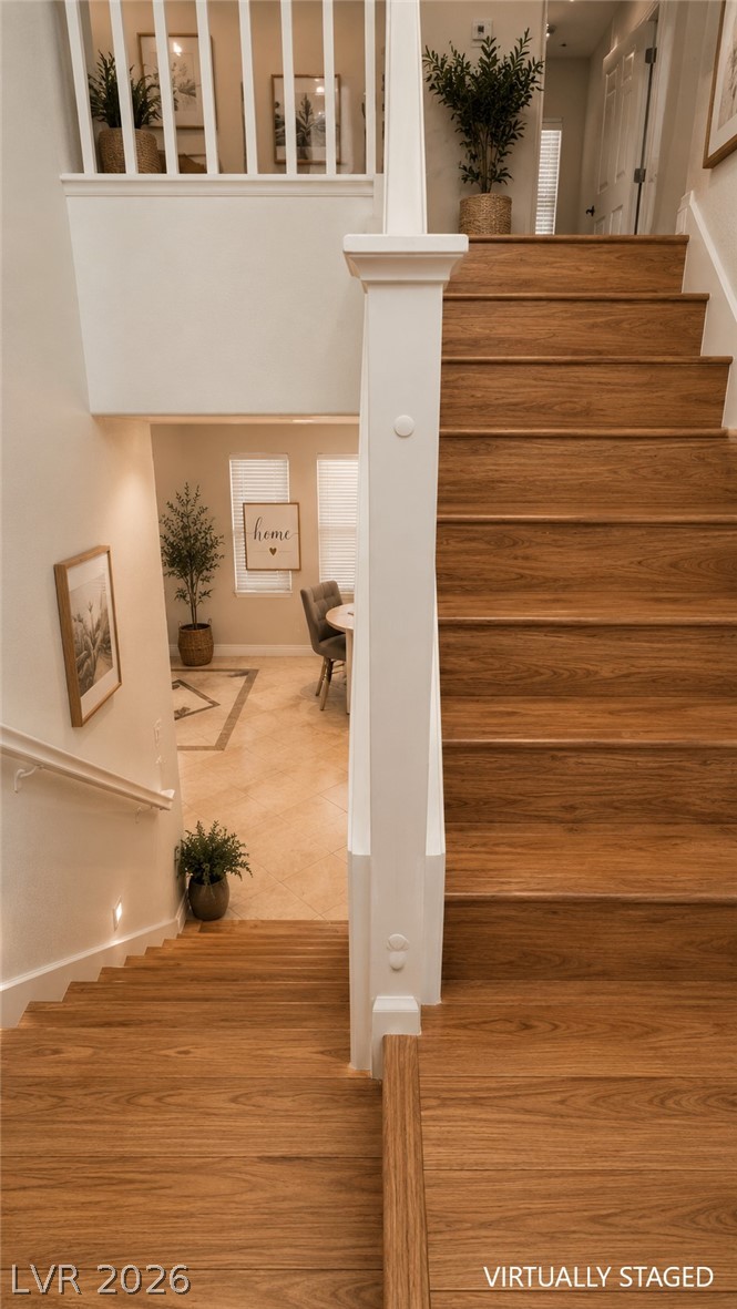 87 Tall Ruff Drive Las Vegas, NV 89148 - Photo 52 of 71 Rich hardwood stairs ascend, offering a warm and inviting transition between levels.