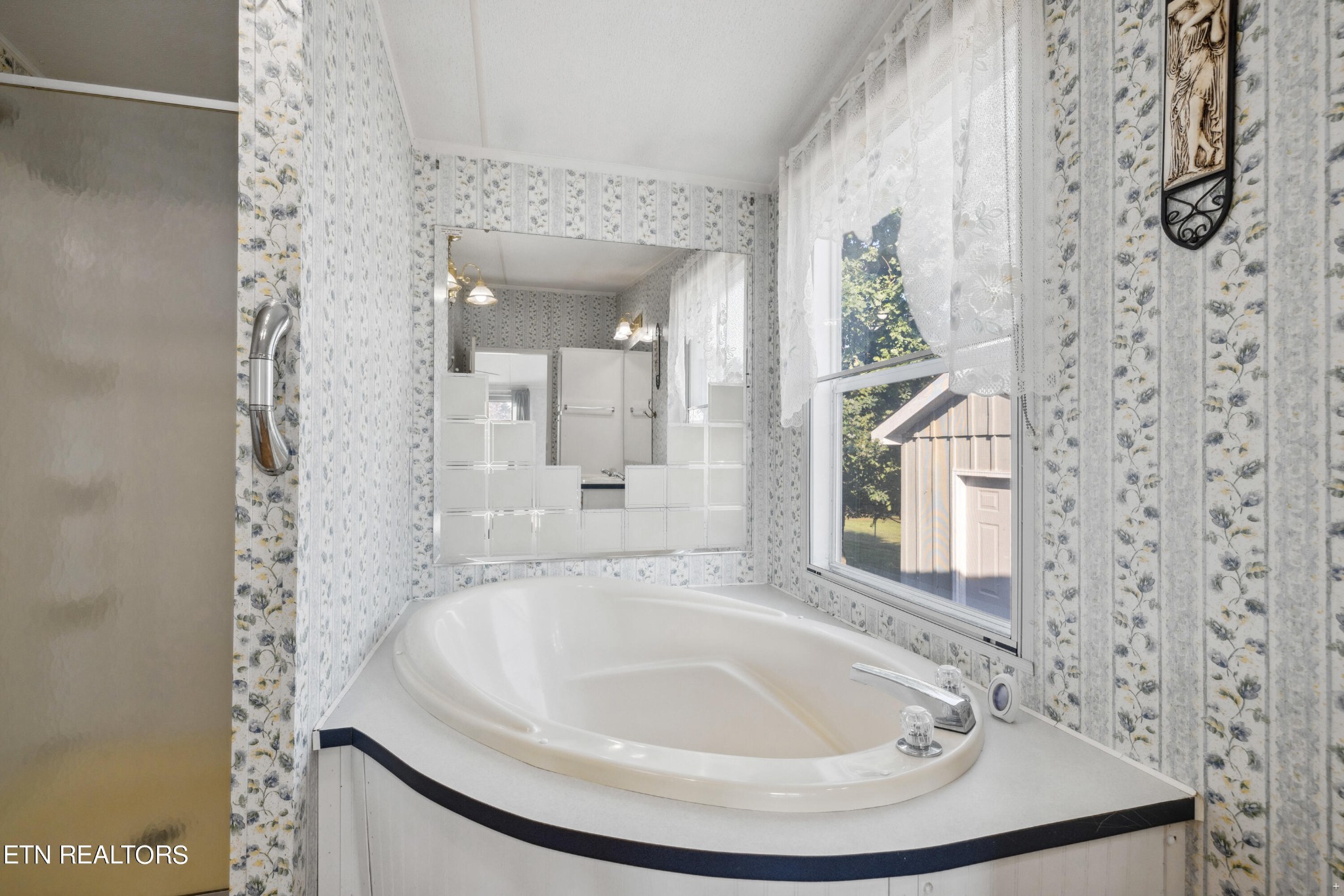 1022 Ridgeview Road Maryville, TN 37801 - Photo 13 of 24 a bathroom with a sink and a mirror