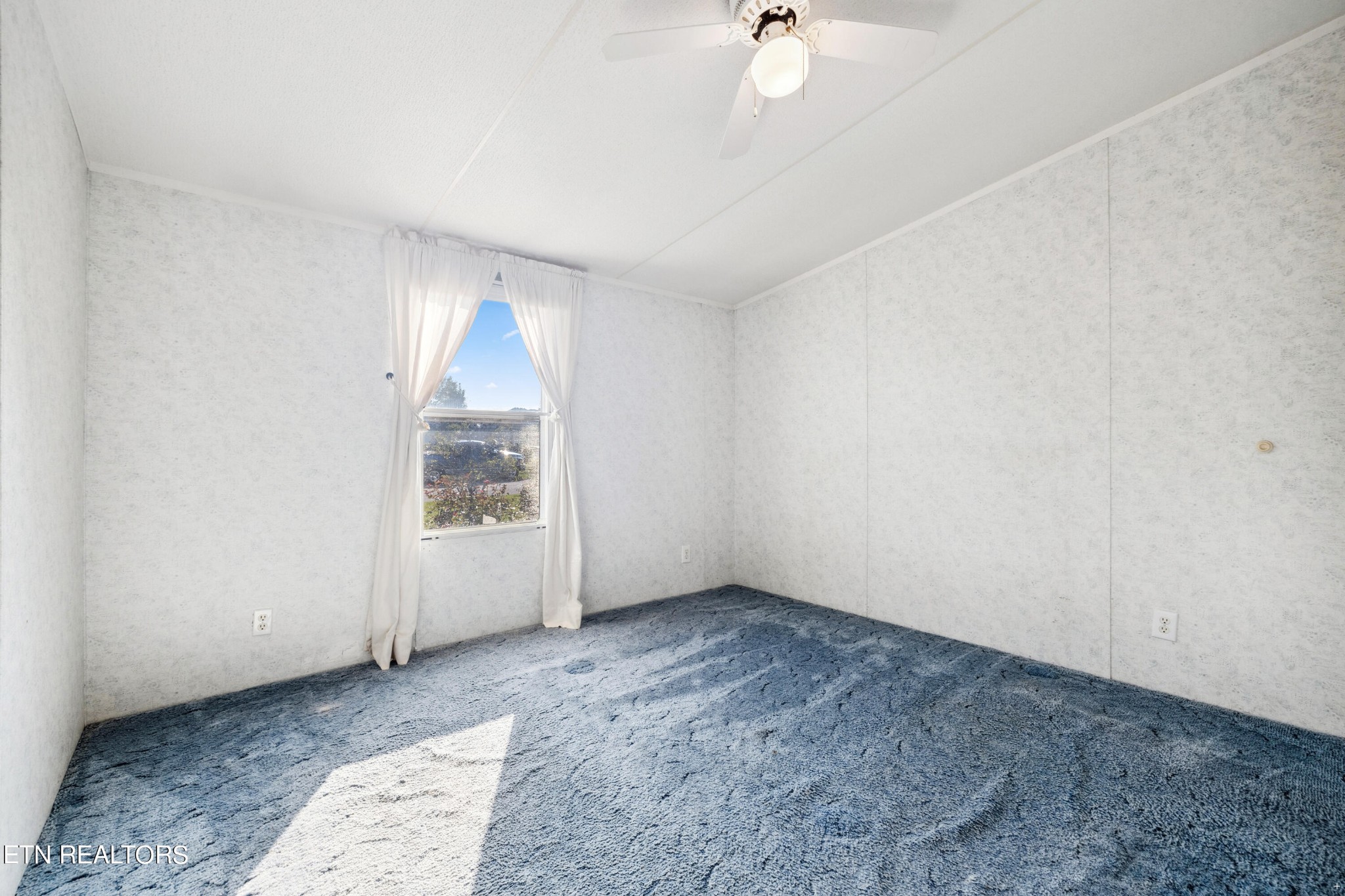 1022 Ridgeview Road Maryville, TN 37801 - Photo 14 of 24 wooden floor in an empty room with a window