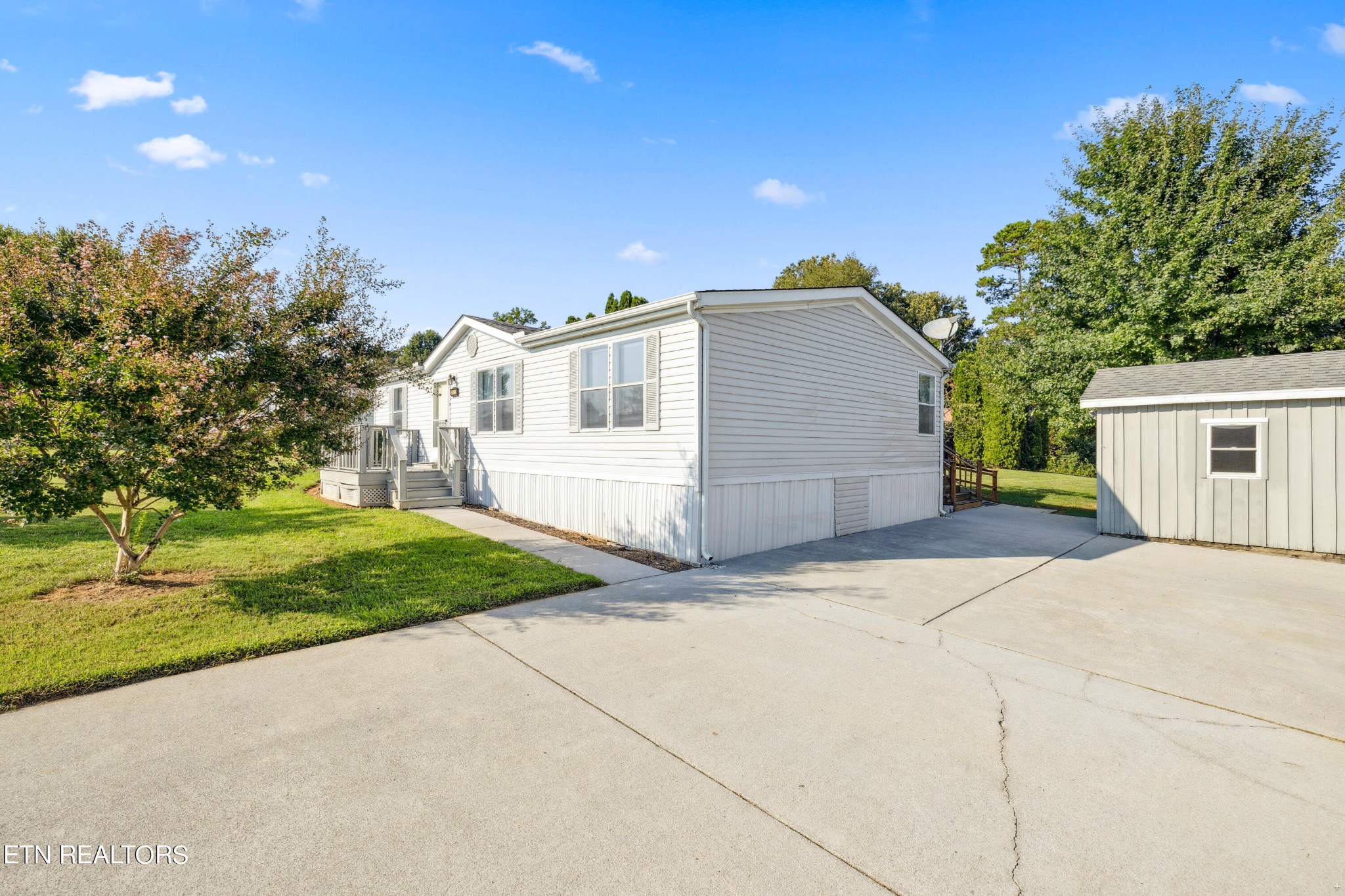 1022 Ridgeview Road Maryville, TN 37801 - Photo 2 of 24 a front view of a house with a yard and a garage