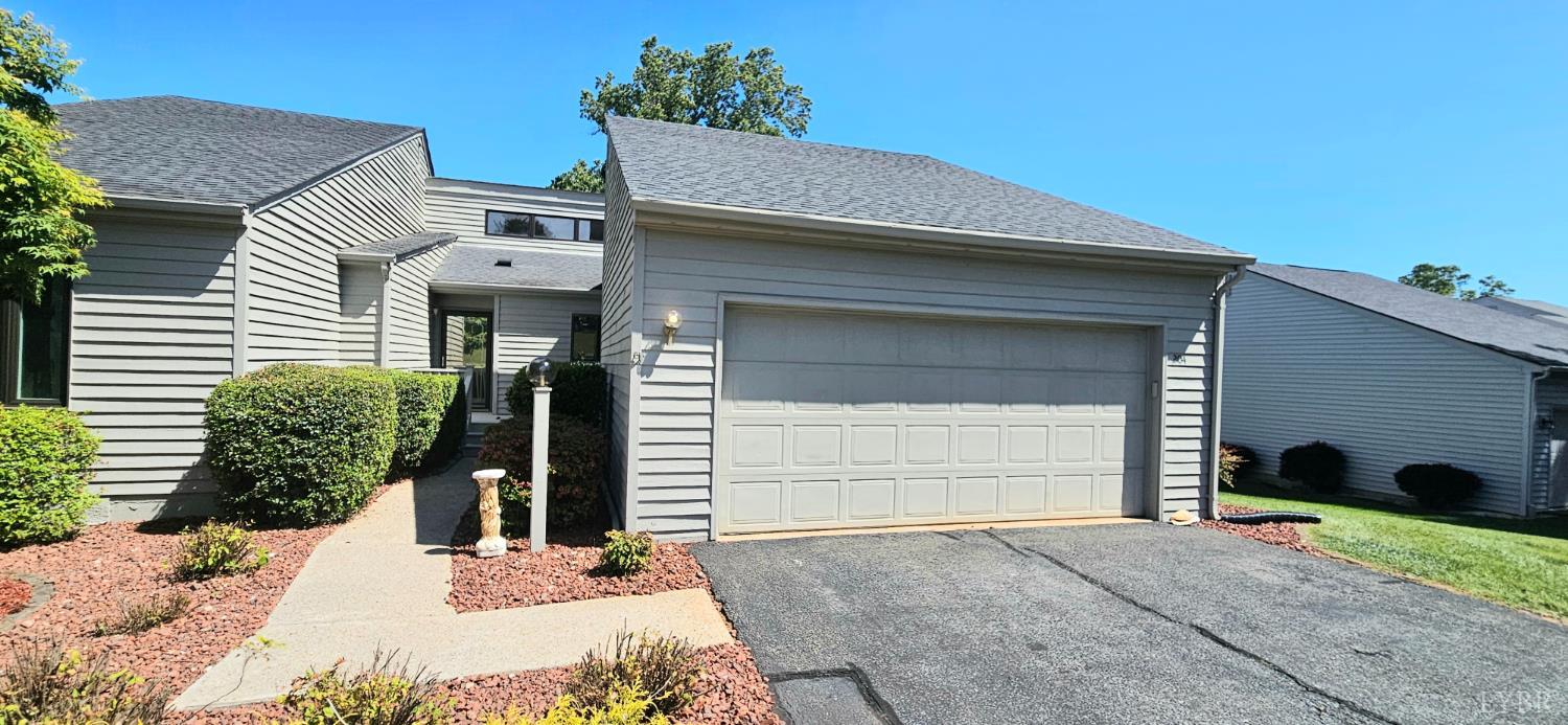 204 Shaker Lane Forest, VA 24551 - Photo 2 of 41 a front view of a house with a yard and garage