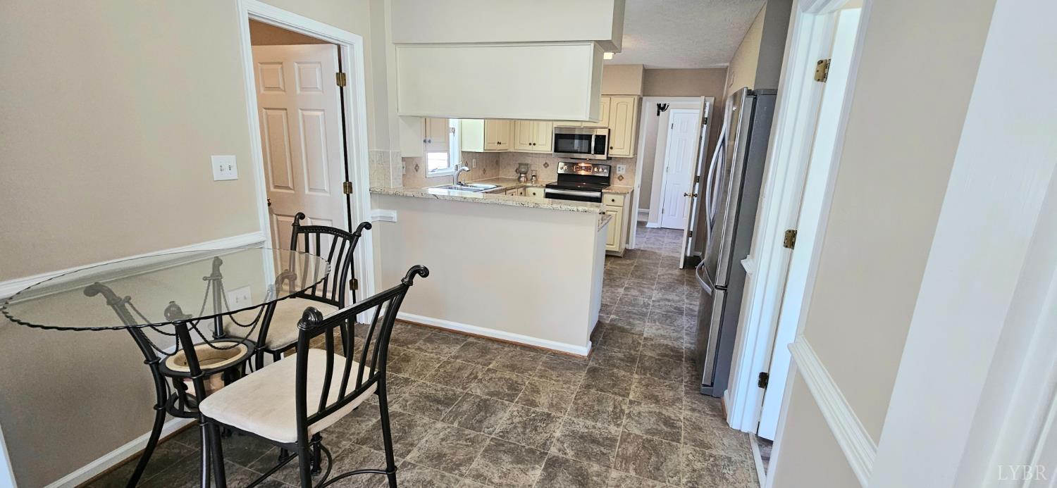 204 Shaker Lane Forest, VA 24551 - Photo 22 of 41 a kitchen with stainless steel appliances a refrigerator and a stove top oven