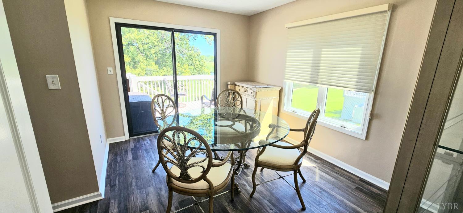 204 Shaker Lane Forest, VA 24551 - Photo 23 of 41 a view of a dining room with furniture window and wooden floor