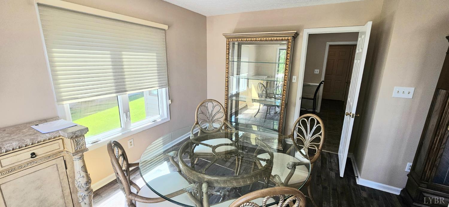 204 Shaker Lane Forest, VA 24551 - Photo 24 of 41 a view of a dining room with furniture window and wooden floor