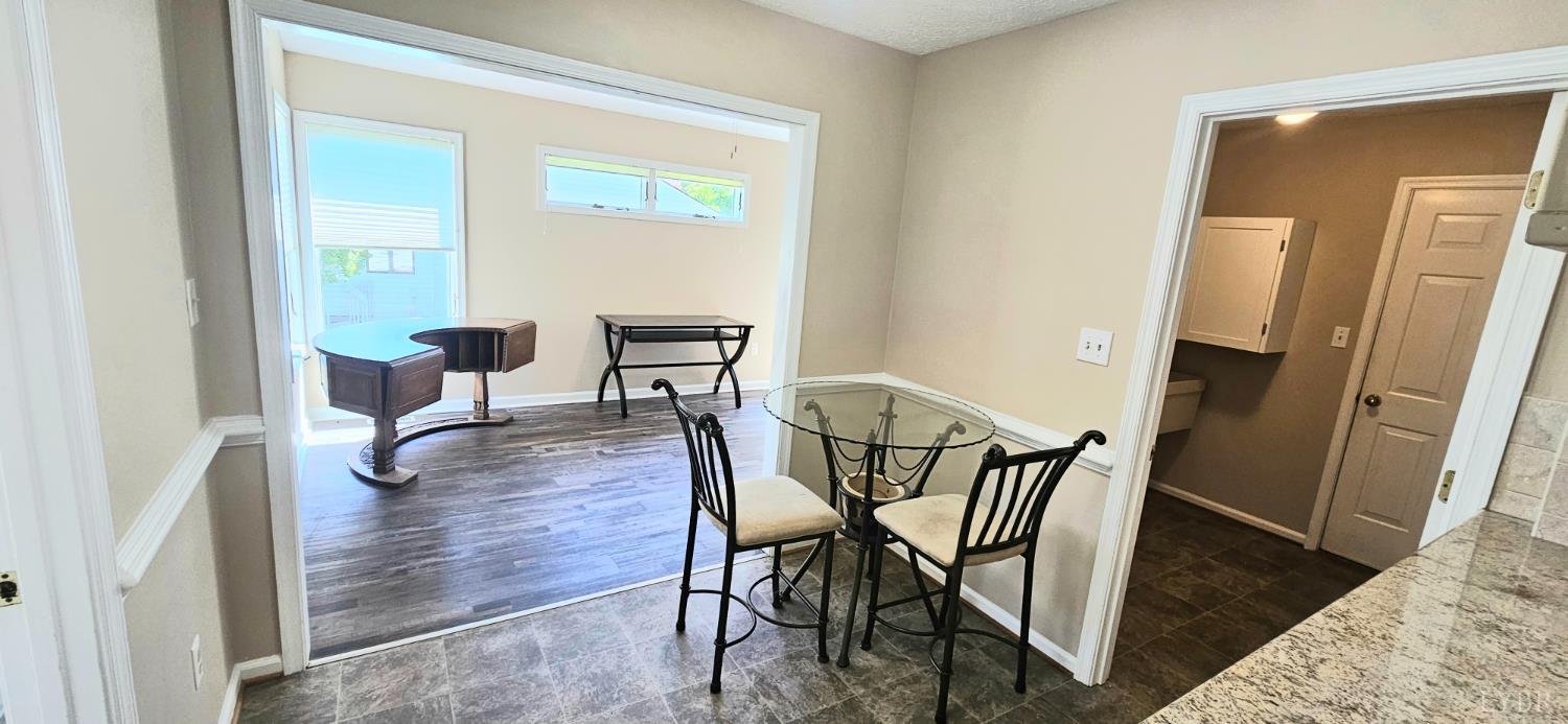 204 Shaker Lane Forest, VA 24551 - Photo 25 of 41 a dining room with furniture and wooden floor