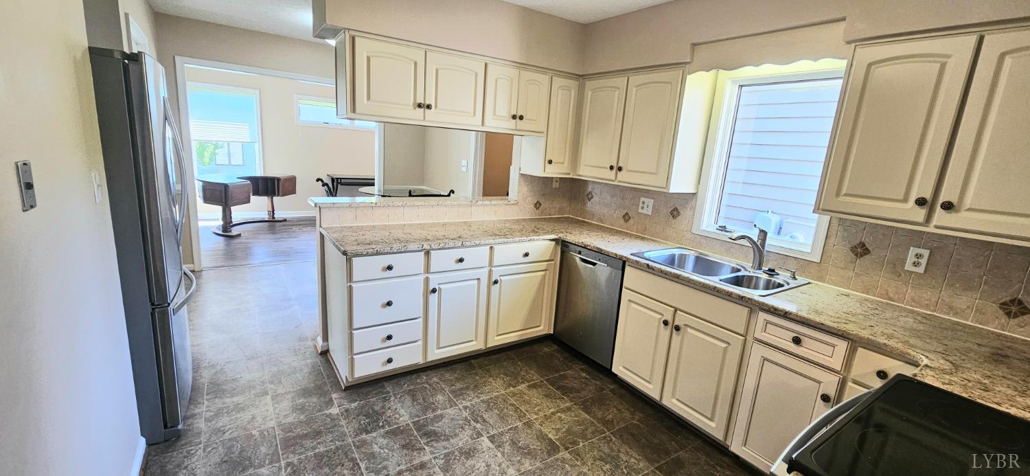 204 Shaker Lane Forest, VA 24551 - Photo 26 of 41 a kitchen with cabinets appliances a sink and a counter top space